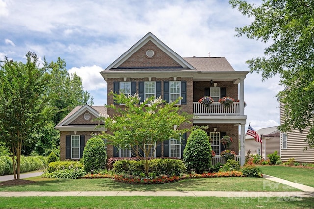10818 Alvarado Way, Charlotte, NC 28277 - colonial home featuring brick siding, a balcony, and a front yard
