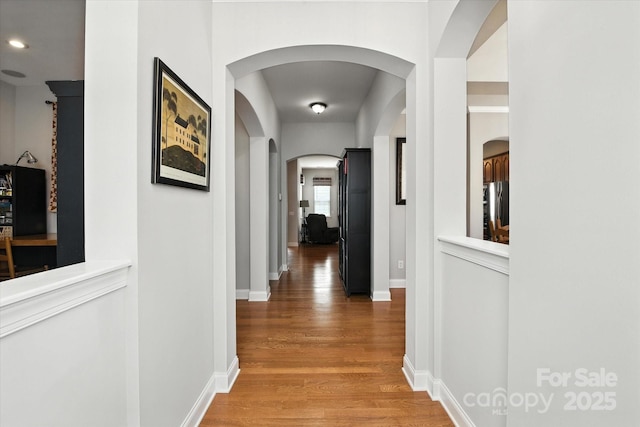 10818 Alvarado Way, Charlotte, NC 28277 - corridor featuring light wood finished floors and arched walkways