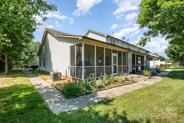 2773 Clover Rd NW, Concord, NC 28027 - view of property exterior featuring a sunroom and a yard