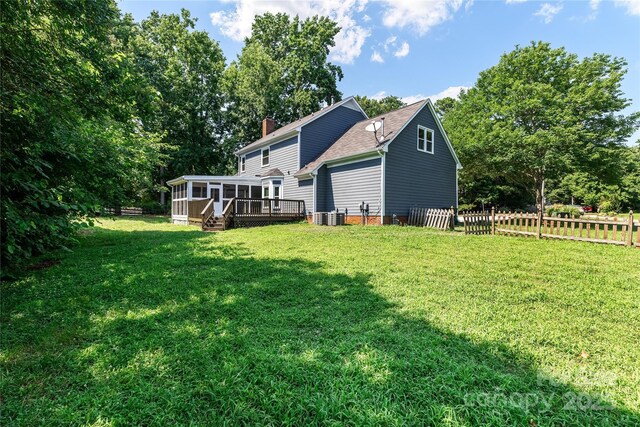 1581 Bluff Ct, Rock Hill, SC 29732 - rear view of property featuring a sunroom, a chimney, a garage, and a shingled roof