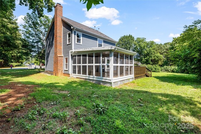 1581 Bluff Ct, Rock Hill, SC 29732 - rear view of property featuring a sunroom, a chimney, and a yard