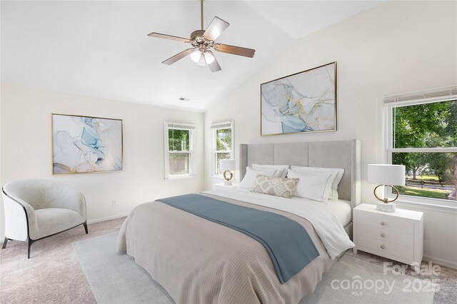 1581 Bluff Ct, Rock Hill, SC 29732 - bedroom with multiple windows, light carpet, lofted ceiling, and a ceiling fan