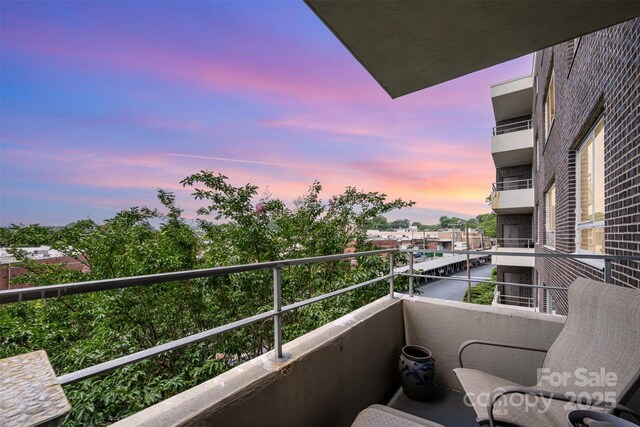 1300 Reece Rd Unit 402, Charlotte, NC 28209 - view of balcony at dusk
