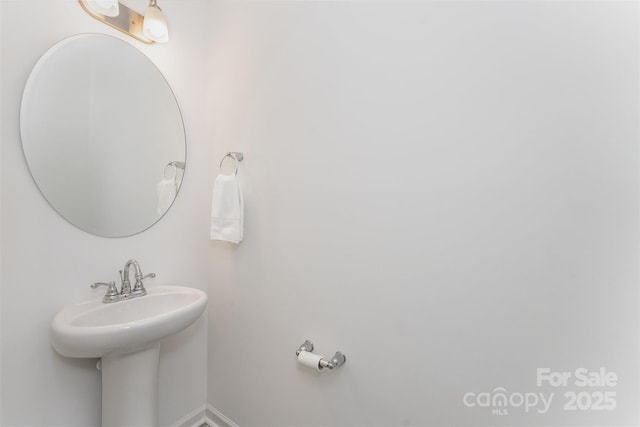 5010 Arbordale Way, Mount Holly, NC 28120 - bathroom featuring baseboards and a sink