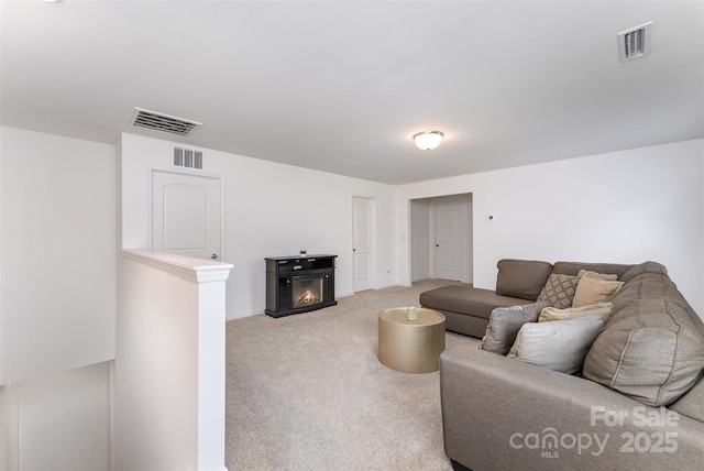 5010 Arbordale Way, Mount Holly, NC 28120 - carpeted living area with a warm lit fireplace and baseboards