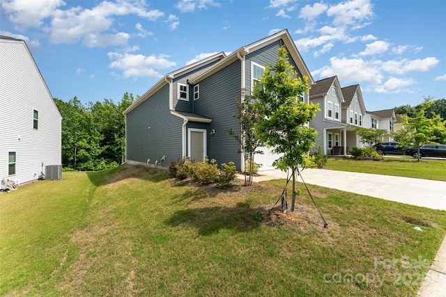 5010 Arbordale Way, Mount Holly, NC 28120 - view of front of house with concrete driveway, an attached garage, a front yard, and a residential view
