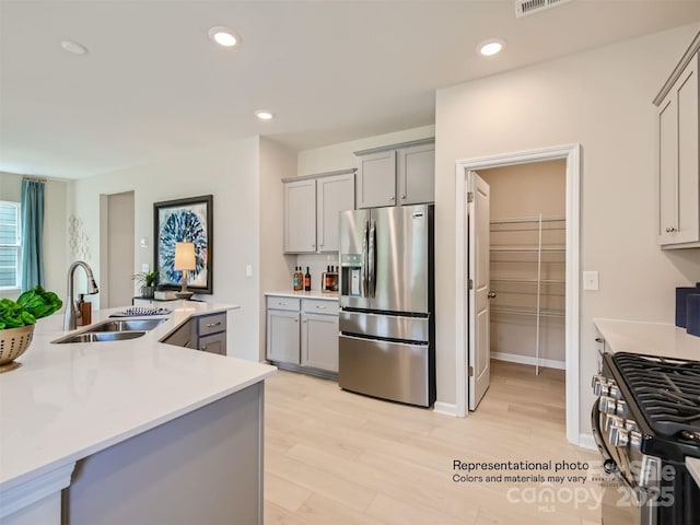 1020 Lookout Shoals Dr, Fort Mill, SC 29715 - kitchen featuring appliances with stainless steel finishes, gray cabinets, light countertops, and recessed lighting