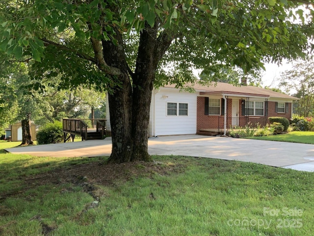 3009 Grier St, Newton, NC 28658 - ranch-style house featuring a front yard, brick siding, driveway, and covered porch