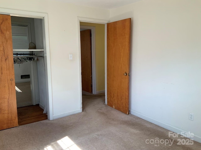 3009 Grier St, Newton, NC 28658 - unfurnished bedroom featuring a closet and carpet
