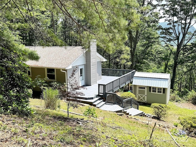 123 Avondale Ridge Rd, Asheville, NC 28803 - view of home's exterior with a chimney, a storage shed, a wooden deck, and stairs