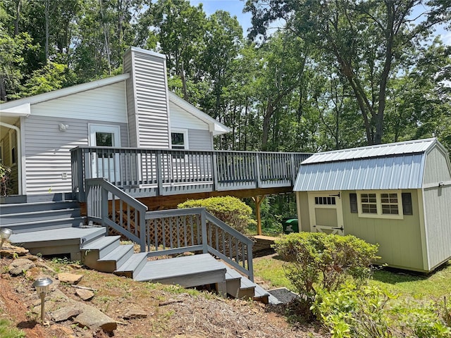 123 Avondale Ridge Rd, Asheville, NC 28803 - deck featuring an outdoor structure and view of scattered trees