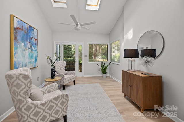4208 Burning Tree Dr, Charlotte, NC 28277 - sitting room featuring a skylight, lofted ceiling, light wood finished floors, and ceiling fan