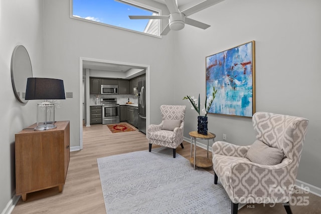 4208 Burning Tree Dr, Charlotte, NC 28277 - living area with a ceiling fan, light wood-style floors, and a high ceiling