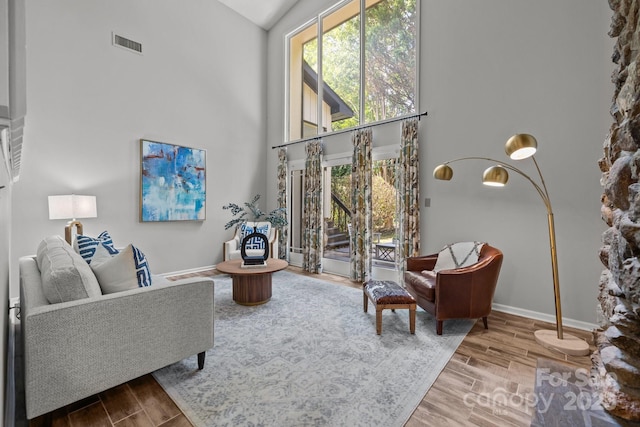 4208 Burning Tree Dr, Charlotte, NC 28277 - living area with a high ceiling, plenty of natural light, and wood finished floors