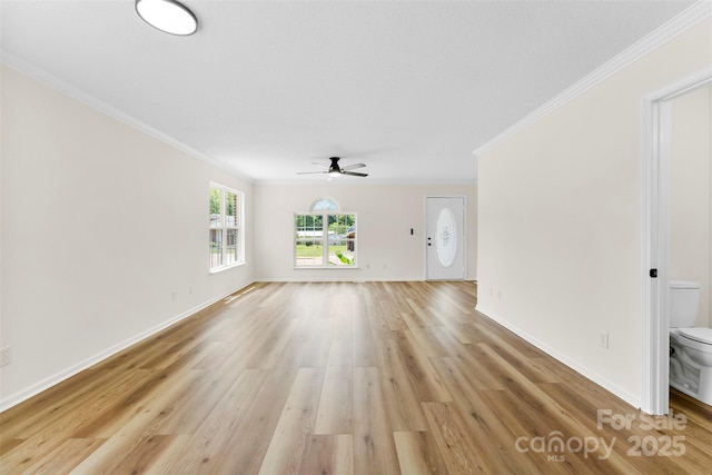 400 N Main Gq St, Granite Quarry, NC 28146 - unfurnished living room with a ceiling fan, ornamental molding, and light wood-type flooring