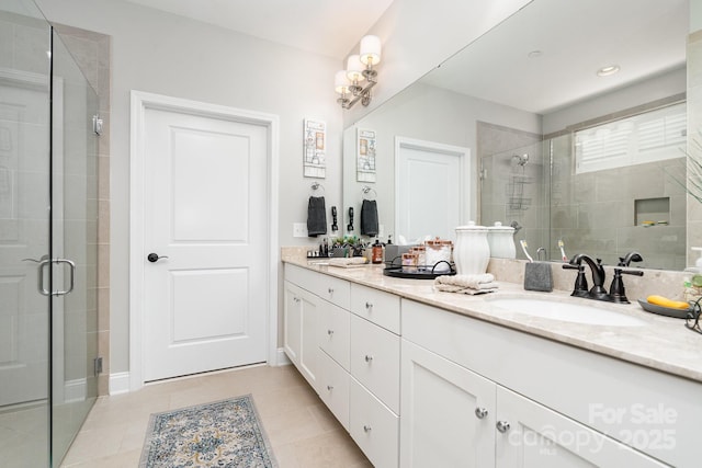 3899 Zemosa Ln NW, Concord, NC 28027 - bathroom featuring double vanity, a shower stall, and tile patterned flooring