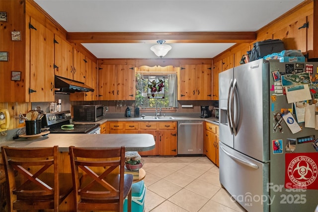 6632 Candlewood Dr, Charlotte, NC 28210 - kitchen featuring stainless steel appliances, under cabinet range hood, a peninsula, light tile patterned floors, and light countertops