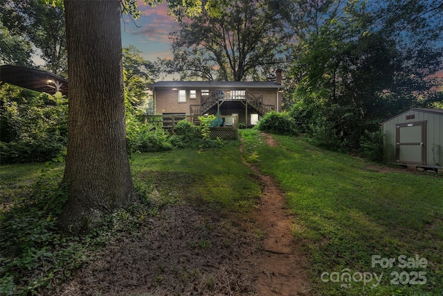 6632 Candlewood Dr, Charlotte, NC 28210 - view of green lawn featuring a storage unit, stairway, and a wooden deck