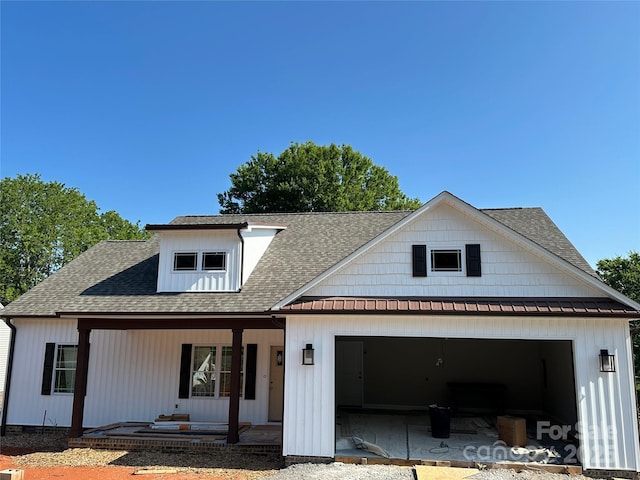 4940 Southview Dr, Hickory, NC 28602 - modern inspired farmhouse with a porch, an attached garage, roof with shingles, a metal roof, and a standing seam roof