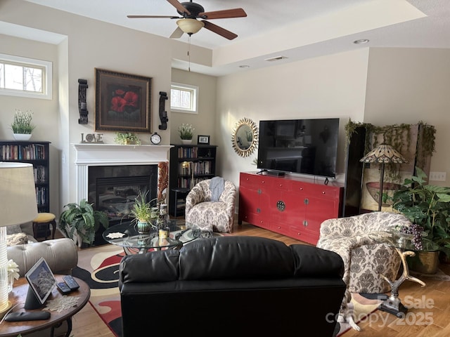 860 Wynnshire Dr, Hickory, NC 28601 - living area featuring ceiling fan, wood finished floors, plenty of natural light, and a glass covered fireplace