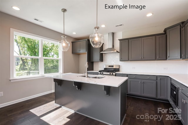 6140 Balham Ct Unit Ken0059, Charlotte, NC 28215 - kitchen with wall chimney range hood, appliances with stainless steel finishes, backsplash, dark wood-type flooring, and recessed lighting