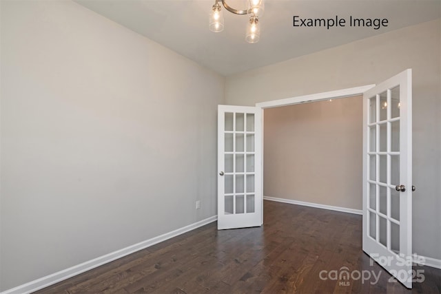6140 Balham Ct Unit Ken0059, Charlotte, NC 28215 - empty room featuring french doors, dark wood-style flooring, and a chandelier
