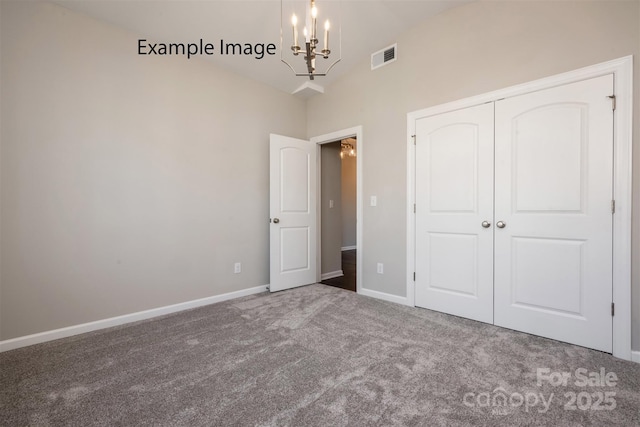 6140 Balham Ct Unit Ken0059, Charlotte, NC 28215 - unfurnished bedroom featuring a chandelier, carpet flooring, lofted ceiling, and a closet