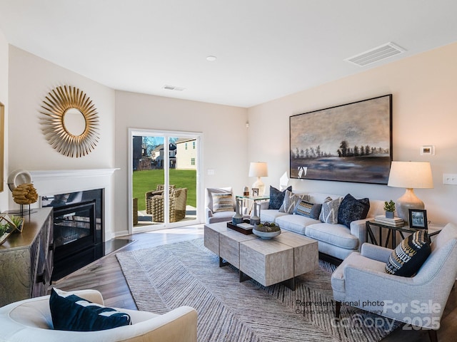 1016 Lookout Shoals Dr, Fort Mill, SC 29715 - living area with wood finished floors and a glass covered fireplace