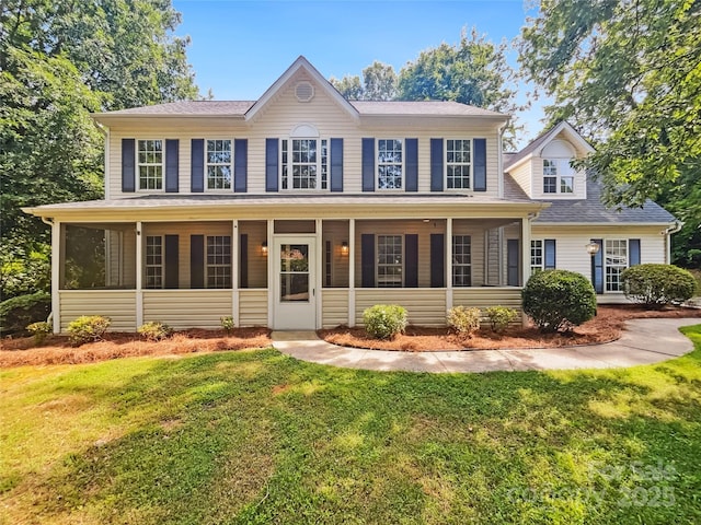 8701 Holly Creek Ct, Charlotte, NC 28216 - colonial inspired home with a sunroom, a front lawn, and a shingled roof