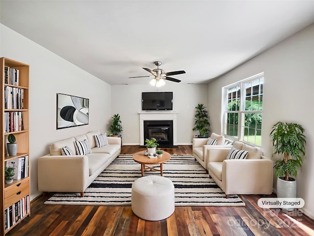 8701 Holly Creek Ct, Charlotte, NC 28216 - living room with wood finished floors, a ceiling fan, and a glass covered fireplace