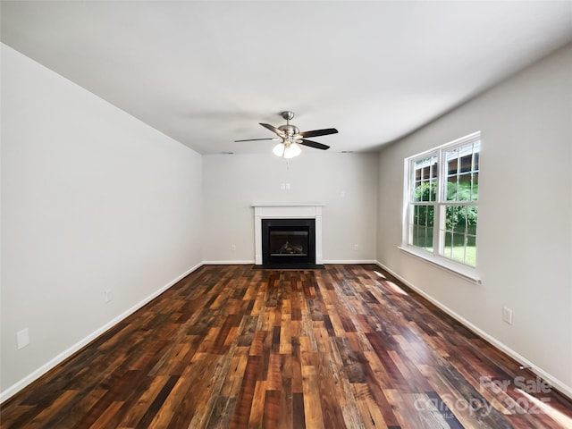 8701 Holly Creek Ct, Charlotte, NC 28216 - unfurnished living room featuring a fireplace with flush hearth, dark wood-type flooring, and ceiling fan