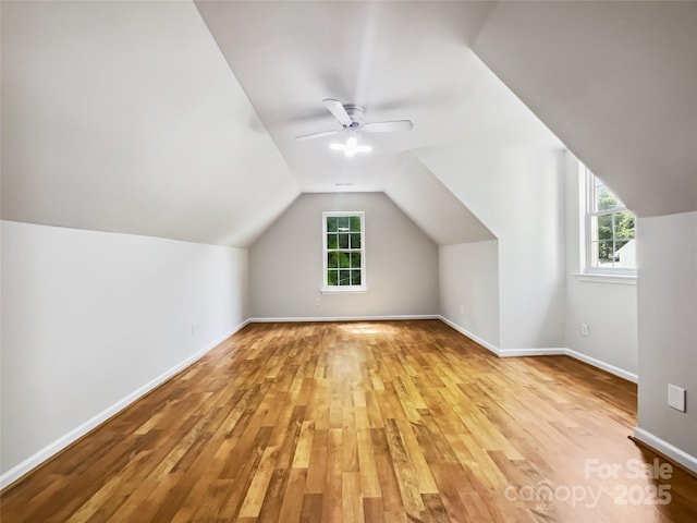 8701 Holly Creek Ct, Charlotte, NC 28216 - additional living space featuring light wood-style flooring, lofted ceiling, and ceiling fan