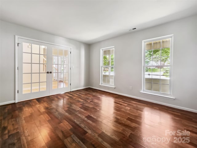 8701 Holly Creek Ct, Charlotte, NC 28216 - empty room featuring french doors and dark wood-style flooring