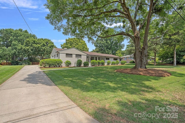 4209 Windwood Cir, Charlotte, NC 28226 - ranch-style home with a front lawn and brick siding