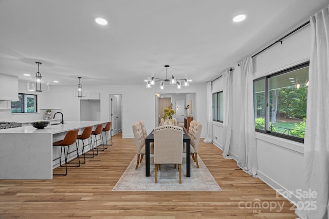 4209 Windwood Cir, Charlotte, NC 28226 - dining area featuring recessed lighting, light wood-style floors, and a chandelier