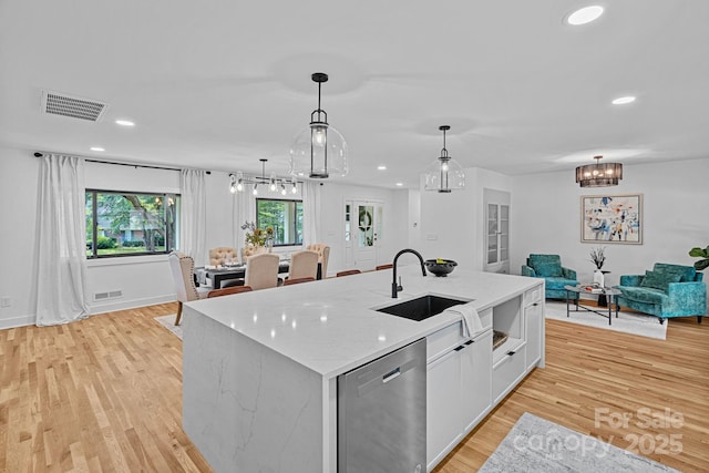 4209 Windwood Cir, Charlotte, NC 28226 - kitchen featuring dishwasher, open floor plan, recessed lighting, a chandelier, and light wood finished floors