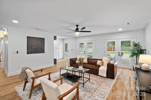 4209 Windwood Cir, Charlotte, NC 28226 - living area with french doors, light wood finished floors, a ceiling fan, and recessed lighting