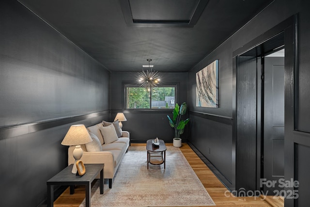 4209 Windwood Cir, Charlotte, NC 28226 - living room featuring light wood-style flooring and attic access