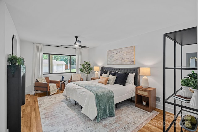 4209 Windwood Cir, Charlotte, NC 28226 - bedroom with wood finished floors and a ceiling fan