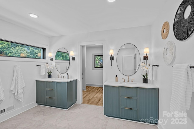 4209 Windwood Cir, Charlotte, NC 28226 - bathroom with two vanities and recessed lighting
