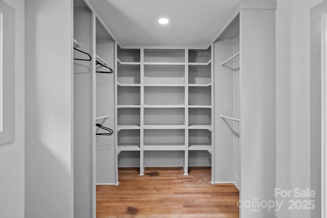 4209 Windwood Cir, Charlotte, NC 28226 - spacious closet featuring wood finished floors