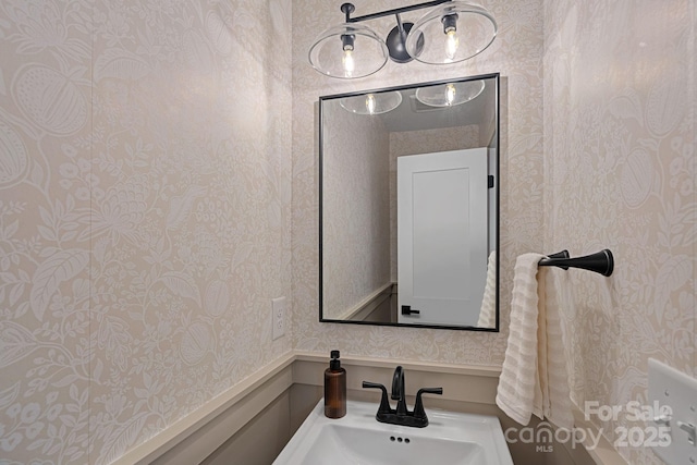 4209 Windwood Cir, Charlotte, NC 28226 - bathroom featuring wallpapered walls and a sink