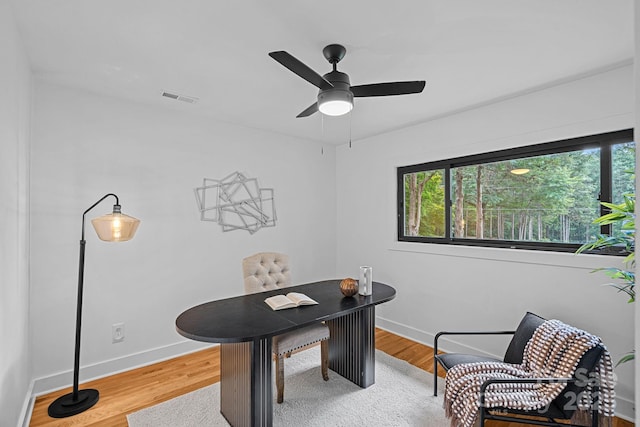 4209 Windwood Cir, Charlotte, NC 28226 - office area featuring light wood finished floors and ceiling fan