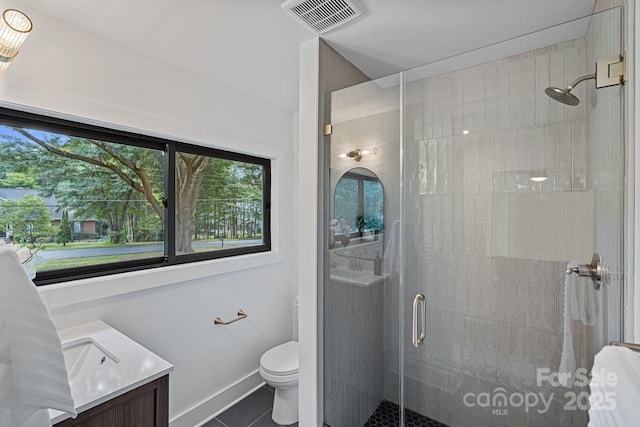 4209 Windwood Cir, Charlotte, NC 28226 - full bath featuring tile patterned flooring, a stall shower, plenty of natural light, and vanity