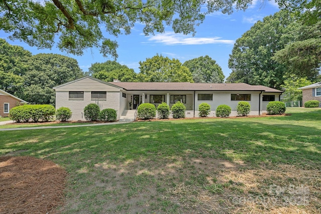 4209 Windwood Cir, Charlotte, NC 28226 - ranch-style home with a front yard and brick siding