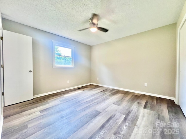 1678 Nelson Dr, Newton, NC 28658 - unfurnished bedroom with wood finished floors, a textured ceiling, and ceiling fan