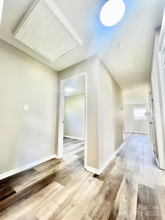 1678 Nelson Dr, Newton, NC 28658 - hall featuring wood finished floors and attic access
