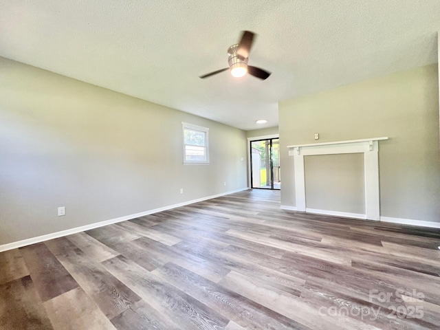 1678 Nelson Dr, Newton, NC 28658 - empty room with a ceiling fan, wood finished floors, and a textured ceiling