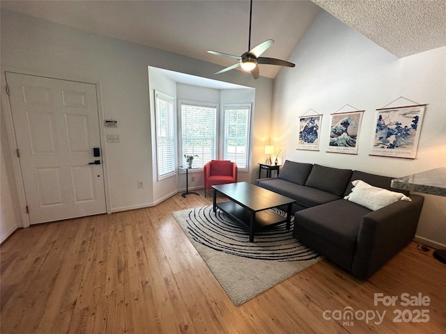 215 Linkside Ct SE, Lenoir, NC 28645 - living room with wood finished floors, ceiling fan, and lofted ceiling