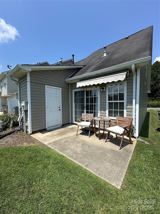 215 Linkside Ct SE, Lenoir, NC 28645 - back of property with a patio area, a yard, and roof with shingles